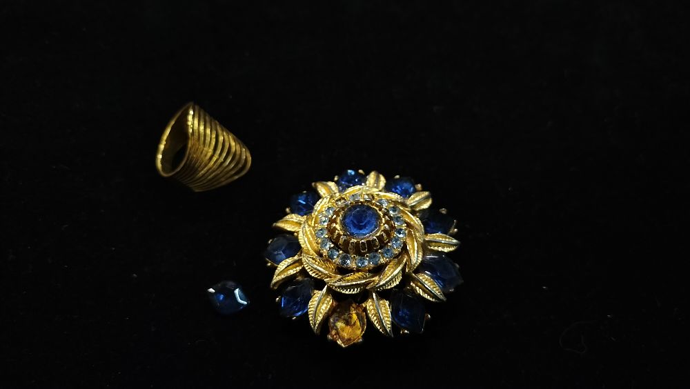 Lot 298: A Weiss Yellow Toned Metal and Blue Glass Brooch and Band Ring