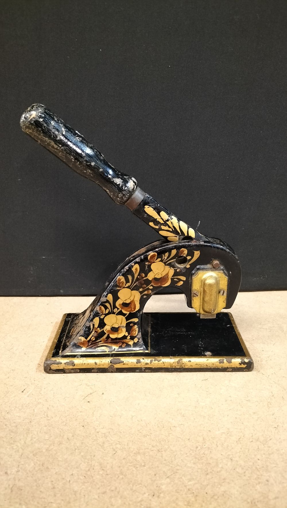 Lot 299: A Victorian Black Japanned and Floral Painted Cast Iron Desktop Document Press