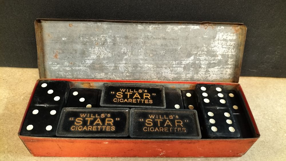 Lot 434: A Set of Wills's Star Cigarettes Bakelite Style Dominoes in a Lithographed Tin