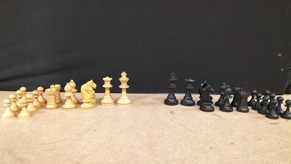 Lot 435: A Set of 32 Turned and Carved Wooden Staunton Chess Pieces