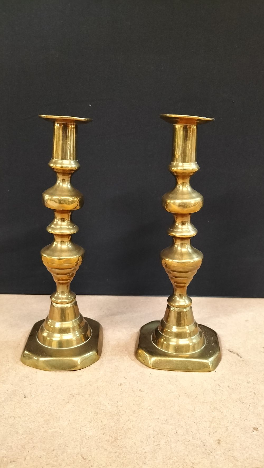 Lot 448: A Pair of Georgian Style Brass Baluster Candlesticks