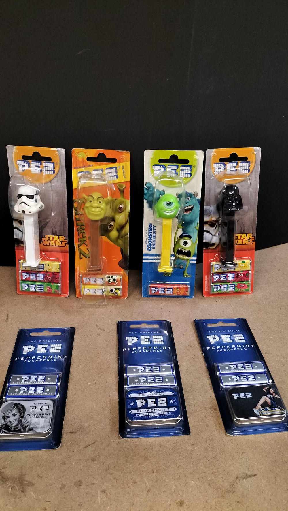 Lot 180: A Collection of 7 PEZ Plastic Character Dispensers and Metal Peppermint Tins