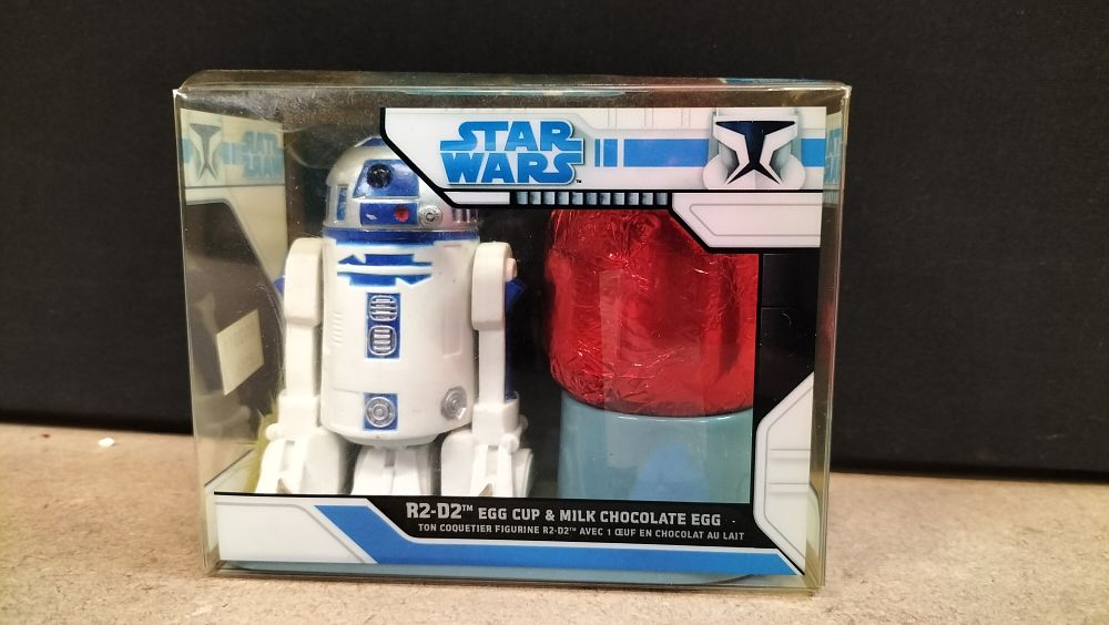 Lot 199: Star Wars The Clone Wars R2-D2 Egg Cup and Milk Chocolate Egg Set