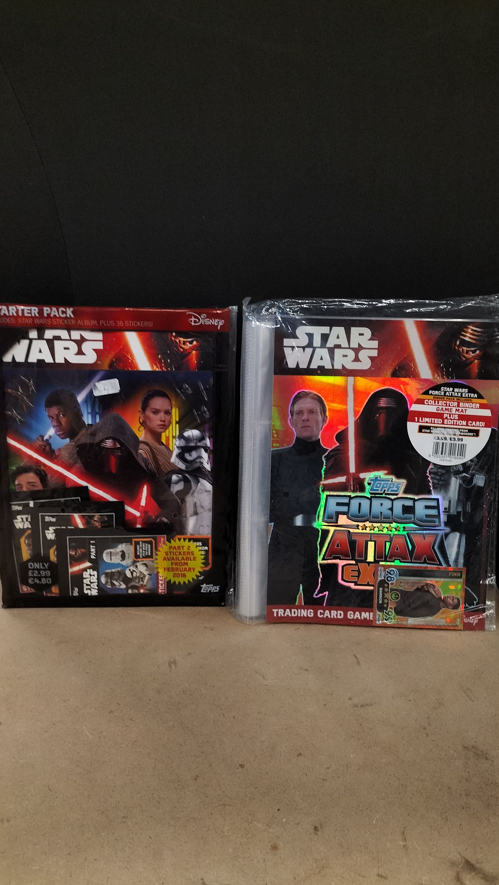 Lot 214: Two Topps Star Wars The Force Awakens Sticker Album and Trading Card Game Starter Sets