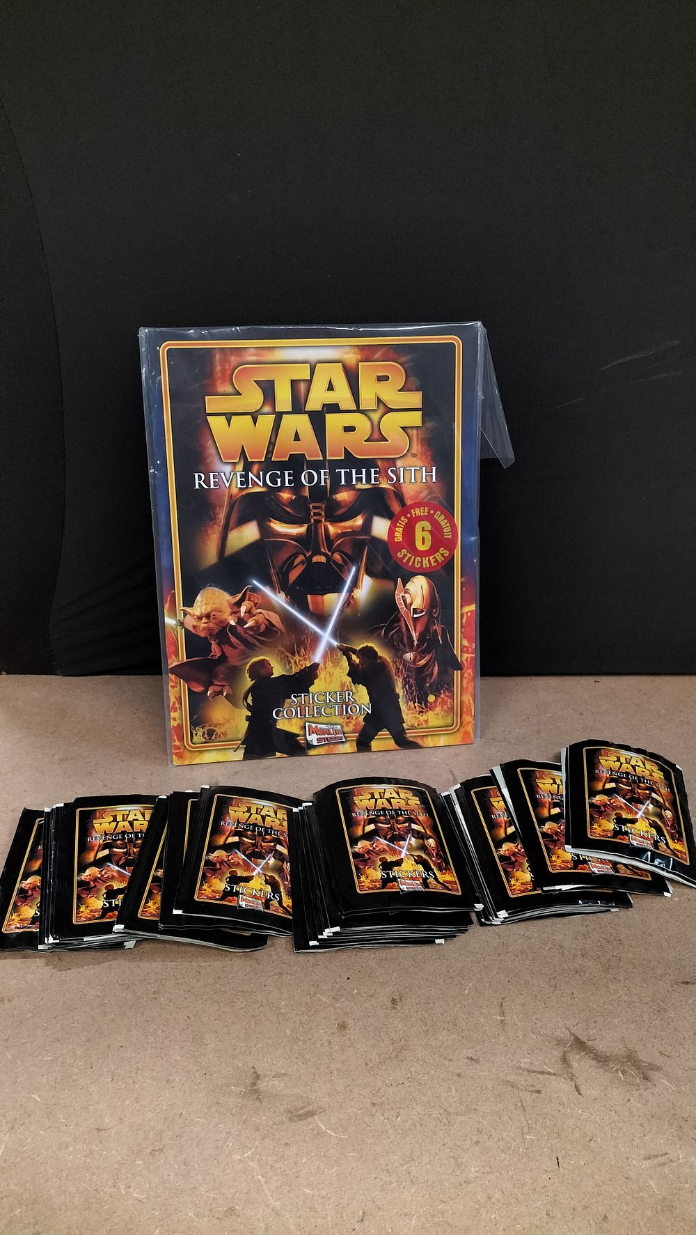 Lot 217: A Collection of Merlin Stickers Star Wars Revenge of the Sith Sealed Packets and Album