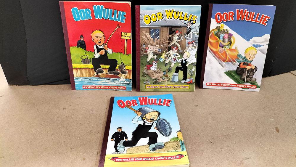 Lot 228: A Set of 4 DC Thomson Oor Wullie Softcover Comic Book Annuals