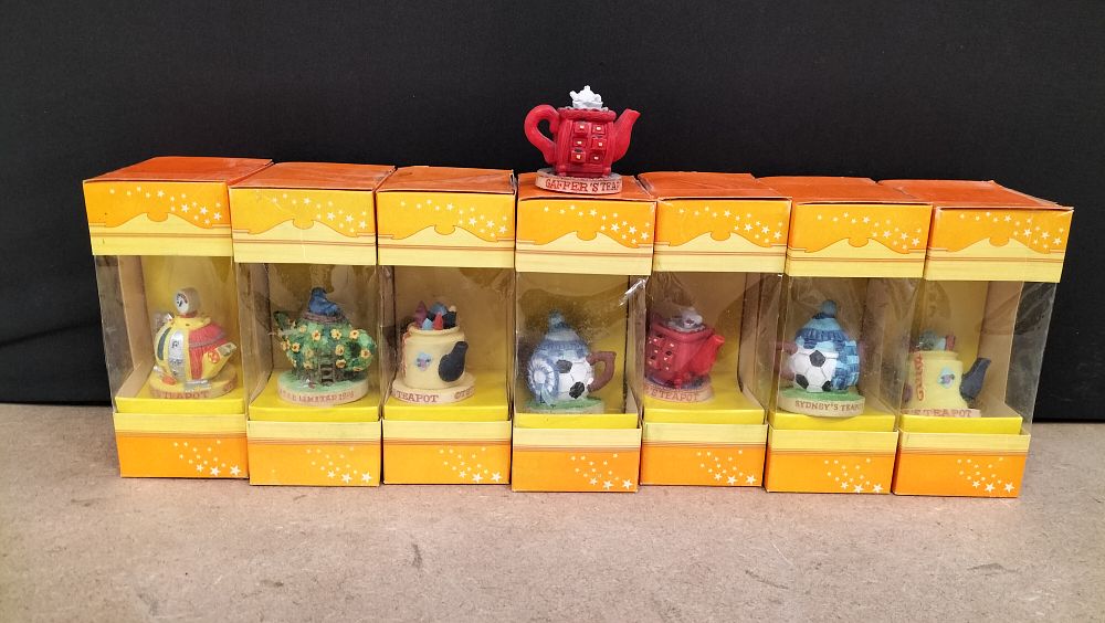 Lot 276: A Collection of 8 Tetley Tea Folk Teapots Resin Figurines