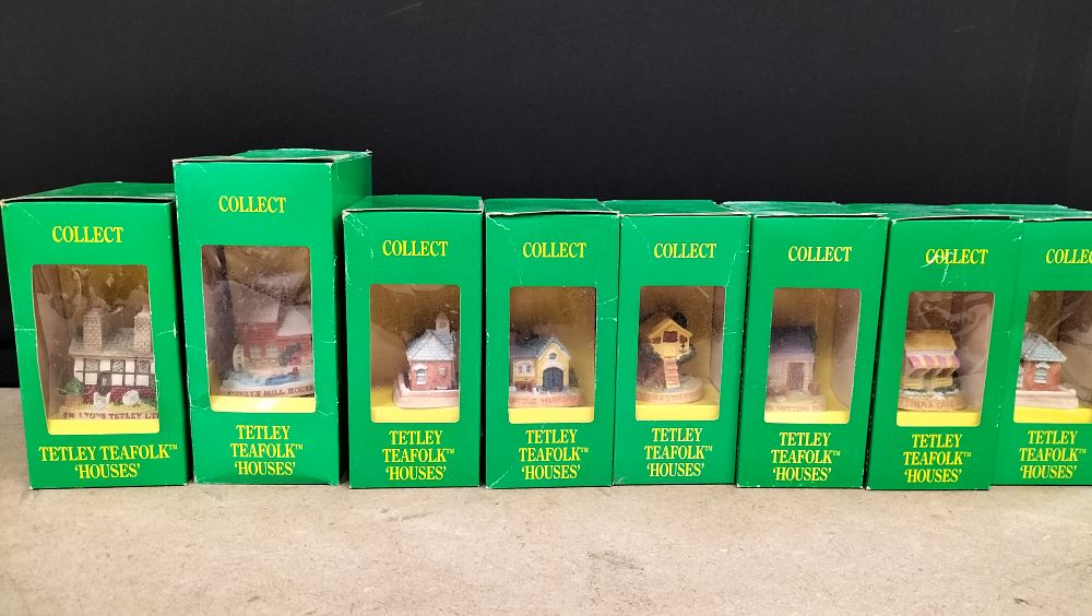 Lot 277: A Collection of 8 Tetley Teafolk Houses Promotional Resin Figures