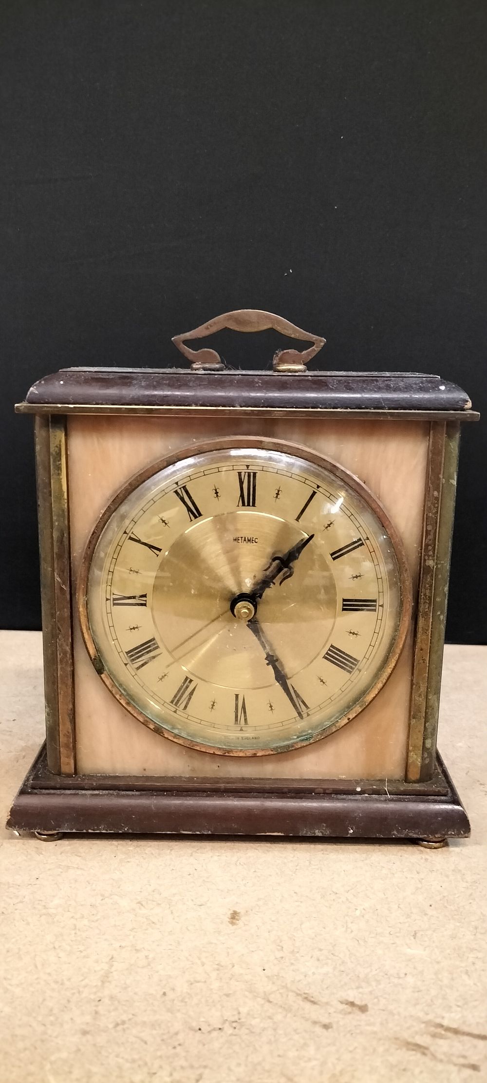 Lot 309: A Metamec Wooden and Resin Mantel Clock, 344