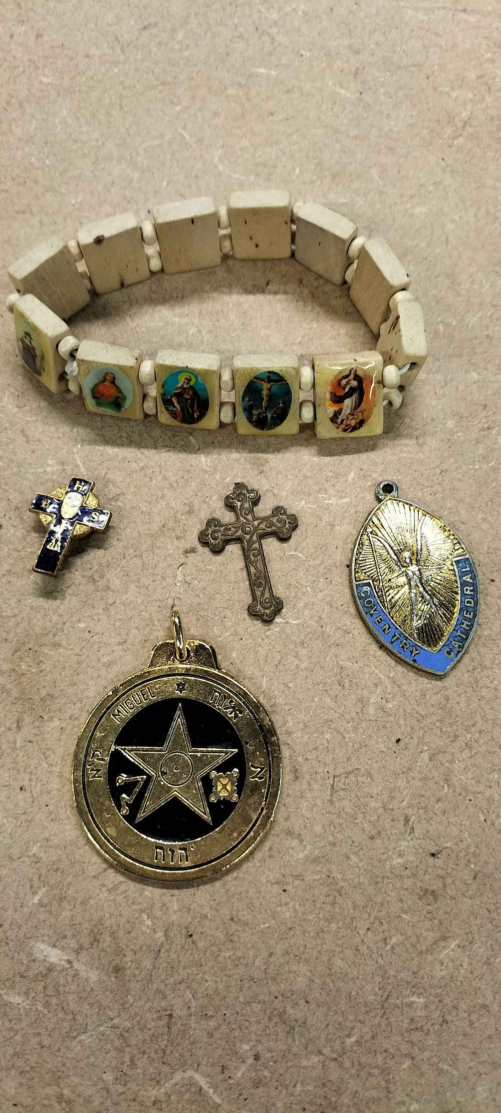 Lot 324: An Assortment of Religious and Talismanic Jewellery including Coventry Cathedral Enamel Pendant