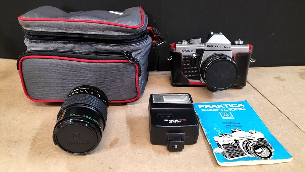 Lot 399: Praktica super TL1000 35mm SLR Camera Outfit with Two Lenses and Accessories