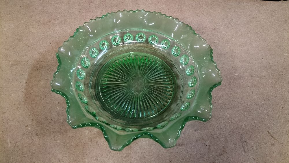 Lot 23: A Green Pressed Glass Bowl with Crimped Rim