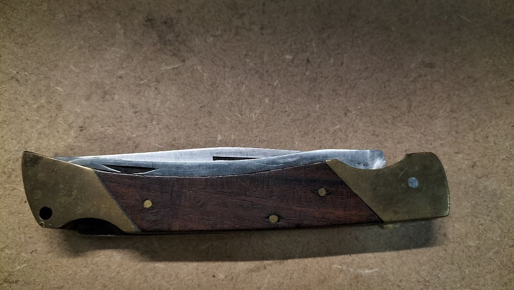 Lot 40: A Hardwood and Brass Two-Blade Folding Multi-Tool Pocket Knife