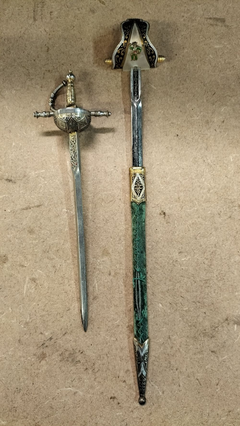 Lot 41: A Pair of Vintage Decorative Metal Miniature Sword Letter Openers Including Bullfighter Style Letter Opener