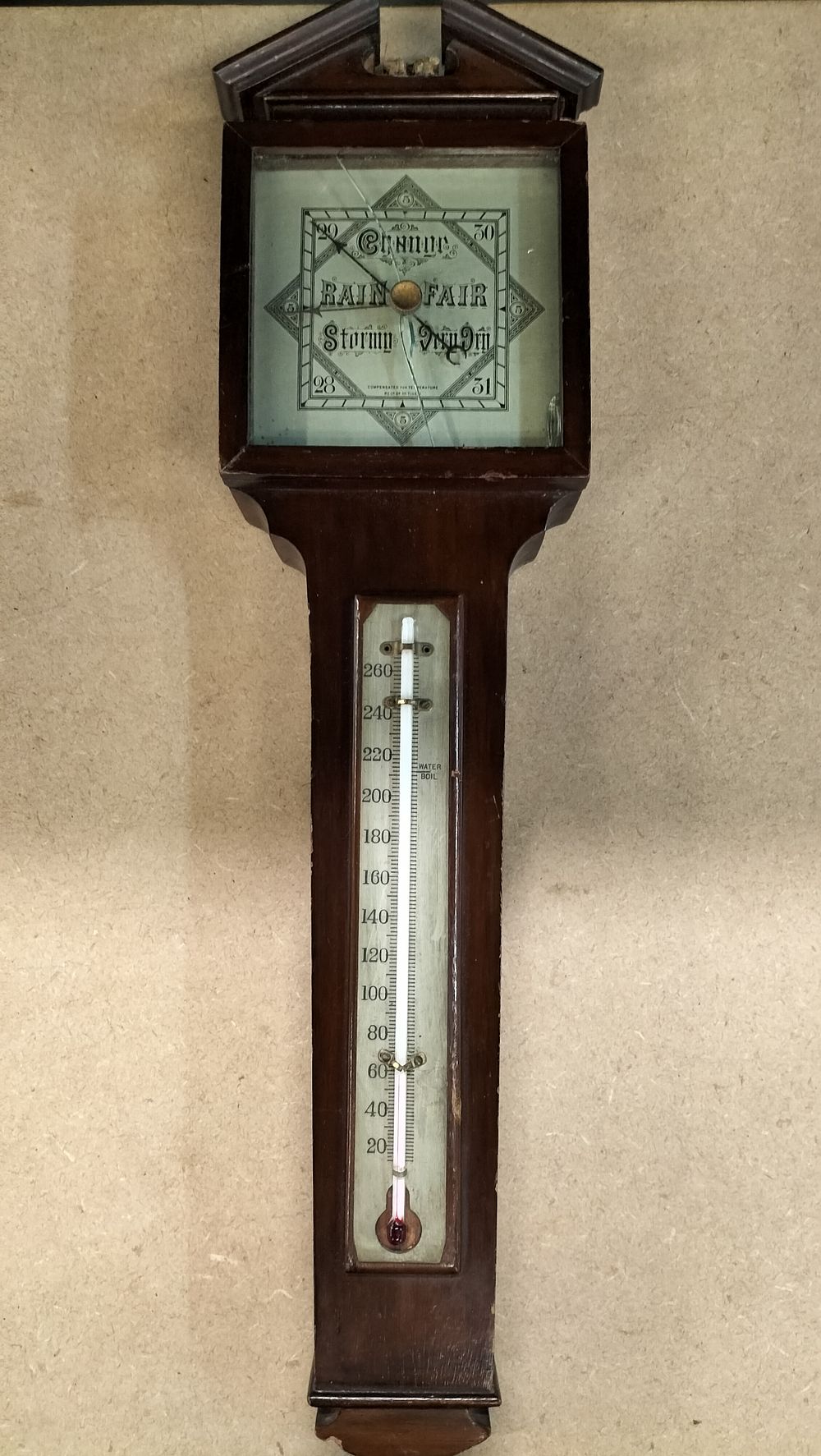 Lot 43: A Dark Wood Aneroid Wheel Barometer with Integrated Thermometer, Reg. No. 714942