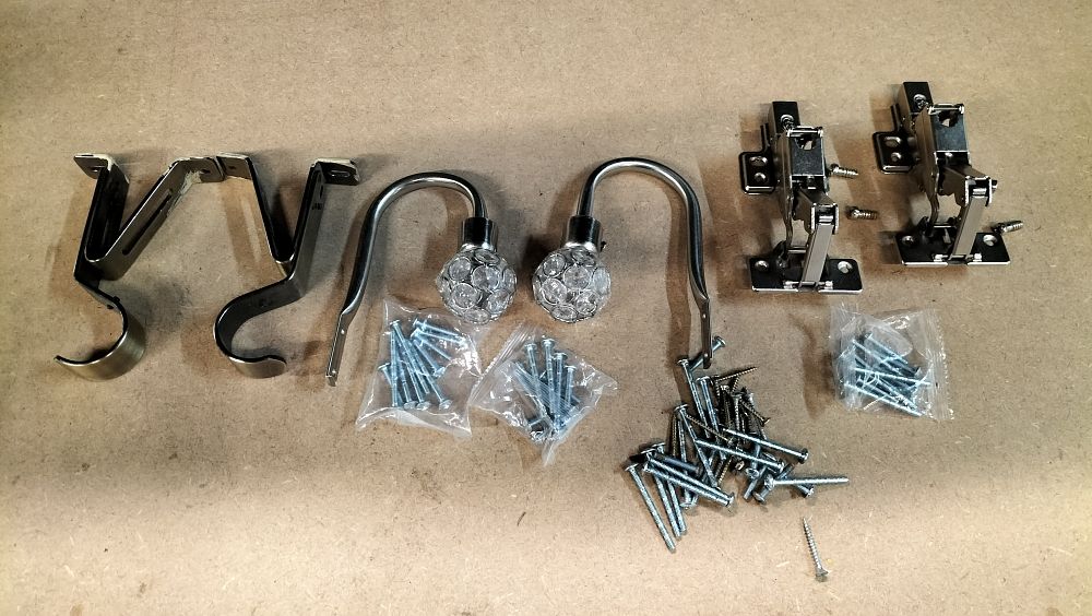 Lot 45: An Assortment of Polished Metal Curtain Hardware and Cabinet Hinges
