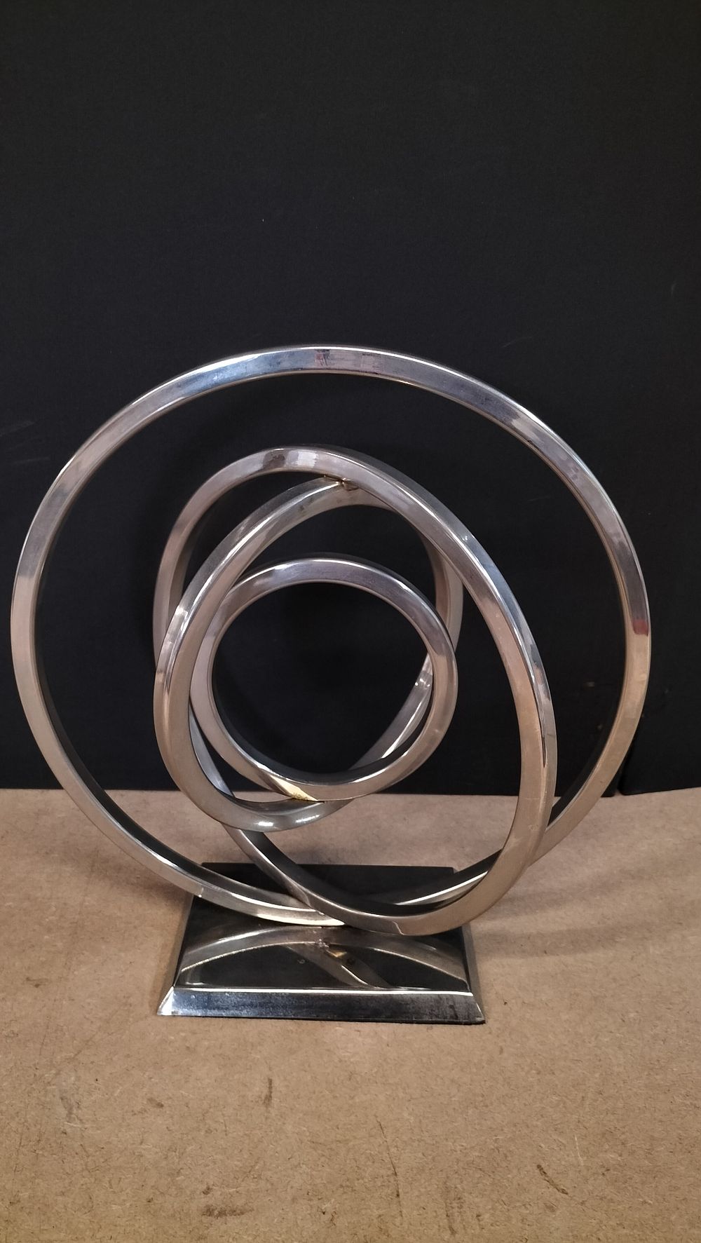 Lot 52: A Chrome Plated Metal Intersecting Ring Sculpture