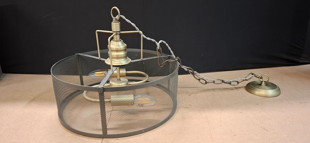 Lot 67: An Industrial Style Antiqued Brass Finish and Metal Mesh Three Light Pendant Chandelier