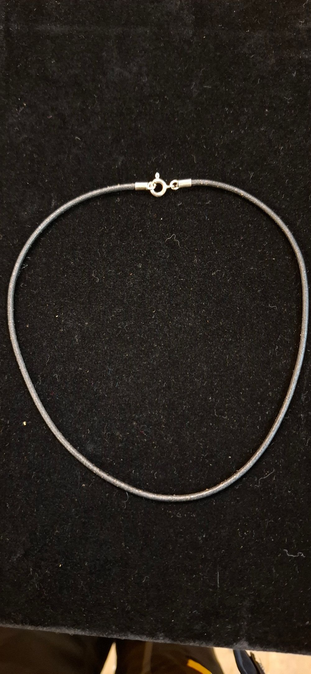Lot 74: A Black Cord Necklace with 925 Sterling Silver Findings