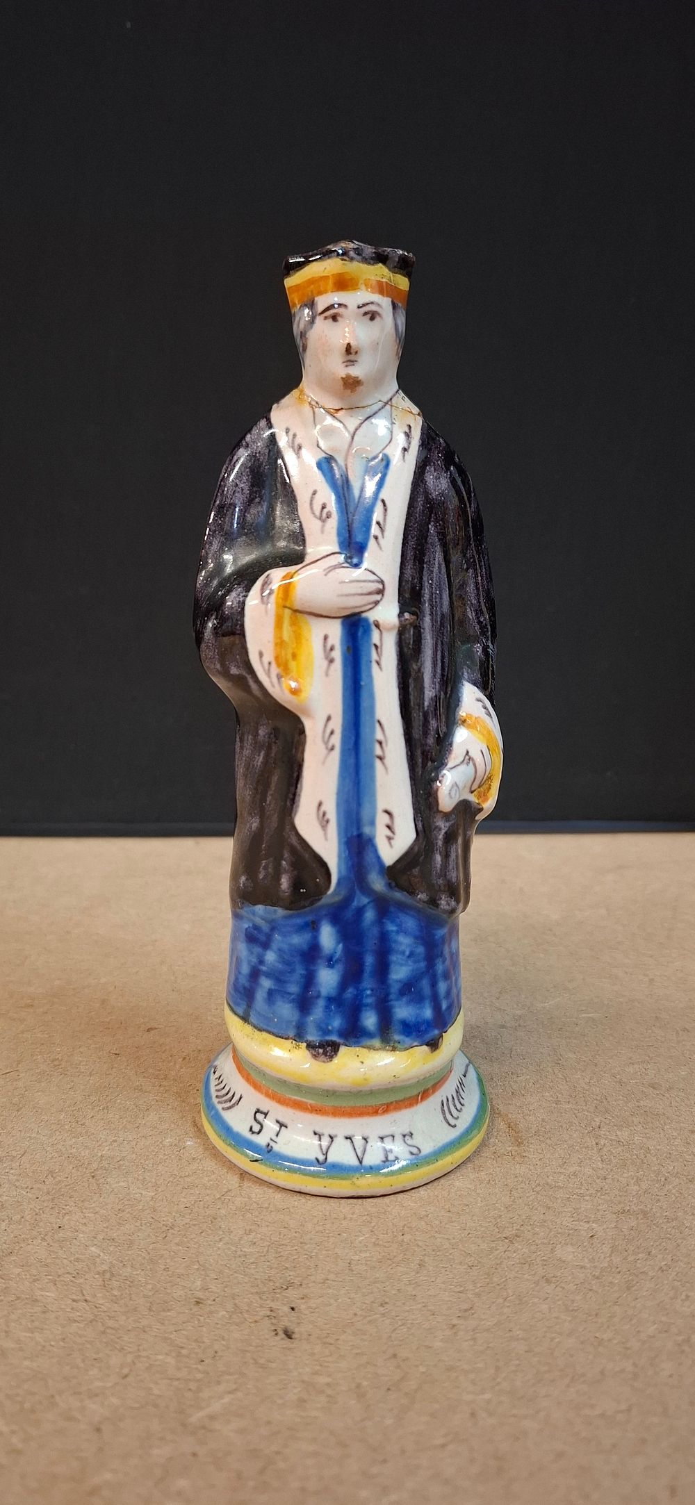 Lot 88: Glazed Ceramic Figurine of St. Yves. Saint Ivo of Kermartin, widely known as the patron saint of lawyers, judges, and notaries.