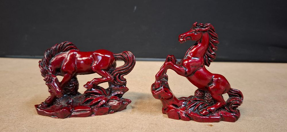 Lot 91: A Pair of Red Resin Horse Figurines