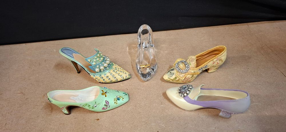 Lot 96: A Collection of Five Decorative Composite and Glass Shoe Figurines