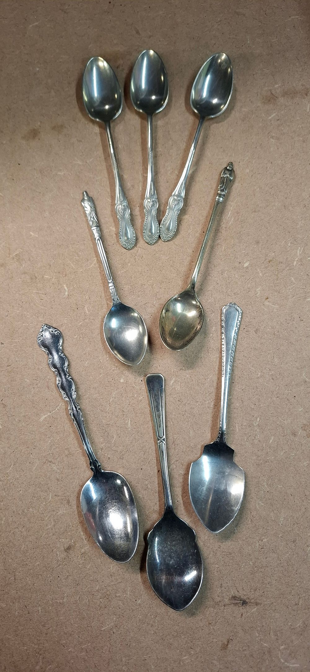 Lot 97: An Assortment of 7 Silver Plated and Stainless Steel Tea Spoons
