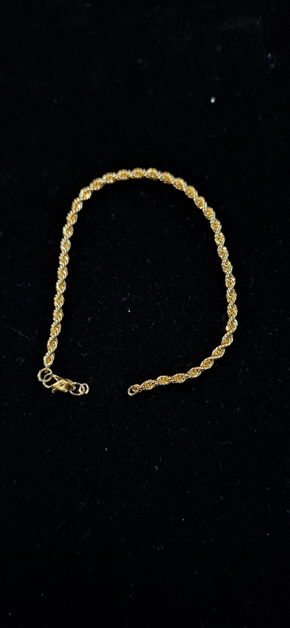 Lot 106: A Gold Tone Rope Link costume Bracelet