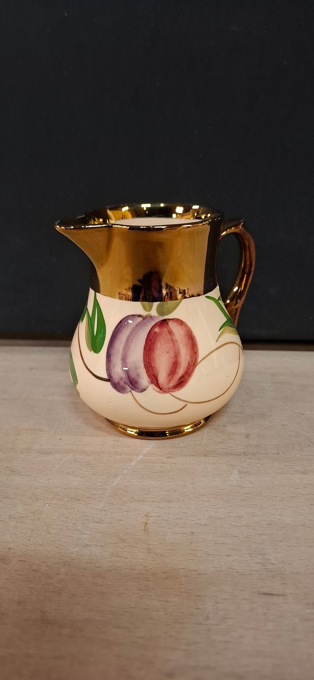 Lot 119: A Wade Hand Painted Gilded Earthenware Creamer
