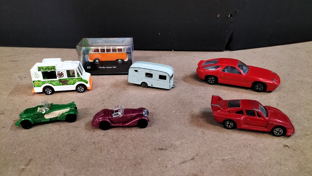 Lot 307: An Assortment of 7 Die-Cast and Plastic Model Vehicles and Accessories