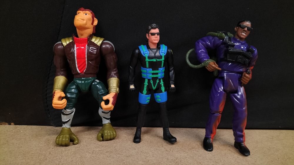 Lot 319: 3 Plastic Movie and Comic Related Action Figures, 1995-1996