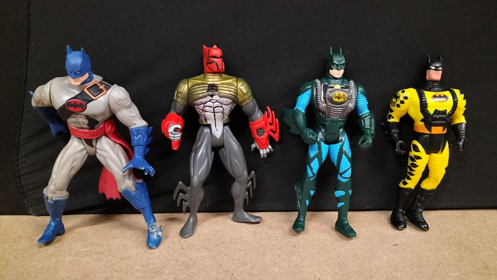 Lot 322: A Collection of 4 Vintage Plastic Batman Universe Action Figures
