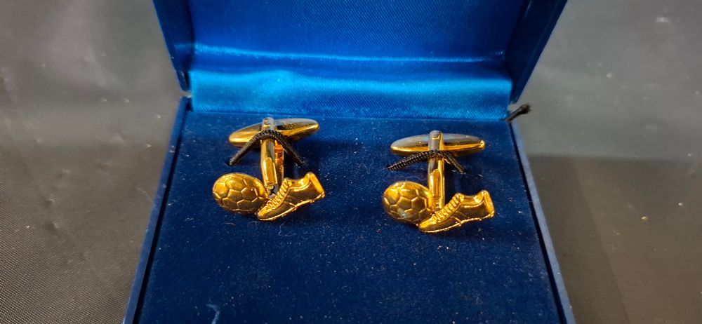 Lot 178: A Pair of Gold Toned Novelty Football Style Cufflinks