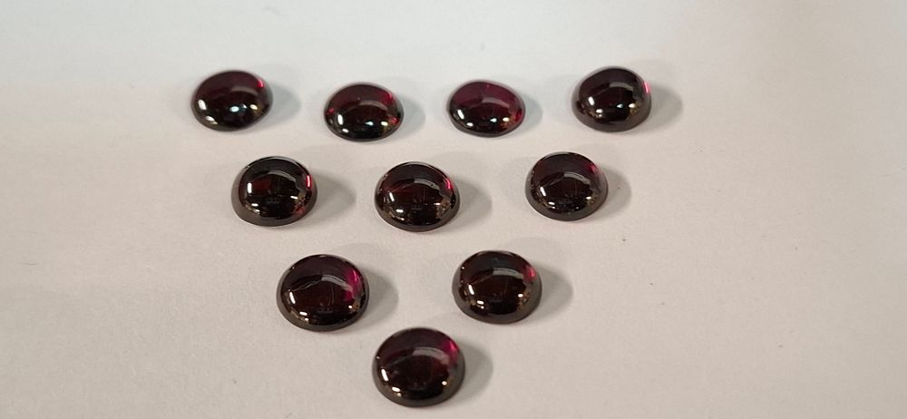 Lot 192: A Set of 10 Round Cabochon Cut Loose African Deep Red Garnet. 7x3 mm Stones