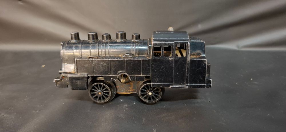 Lot 200: A Vintage Clockwork Plastic and Metal Steam Locomotive