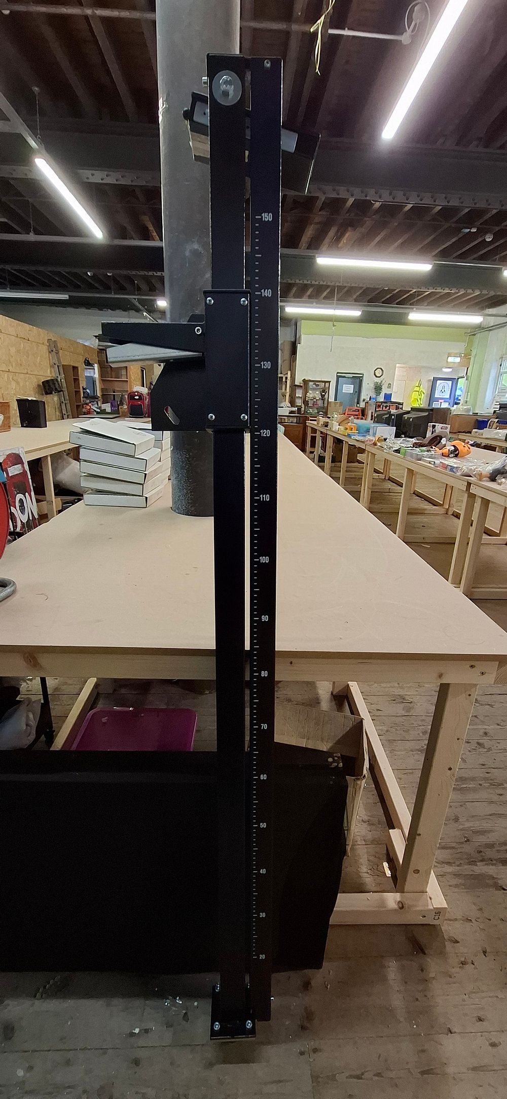 Lot 240: A Black Metal Industrial Laser Measuring Rail with Integrated 130 cm Scale.  COLLECTION ONLY