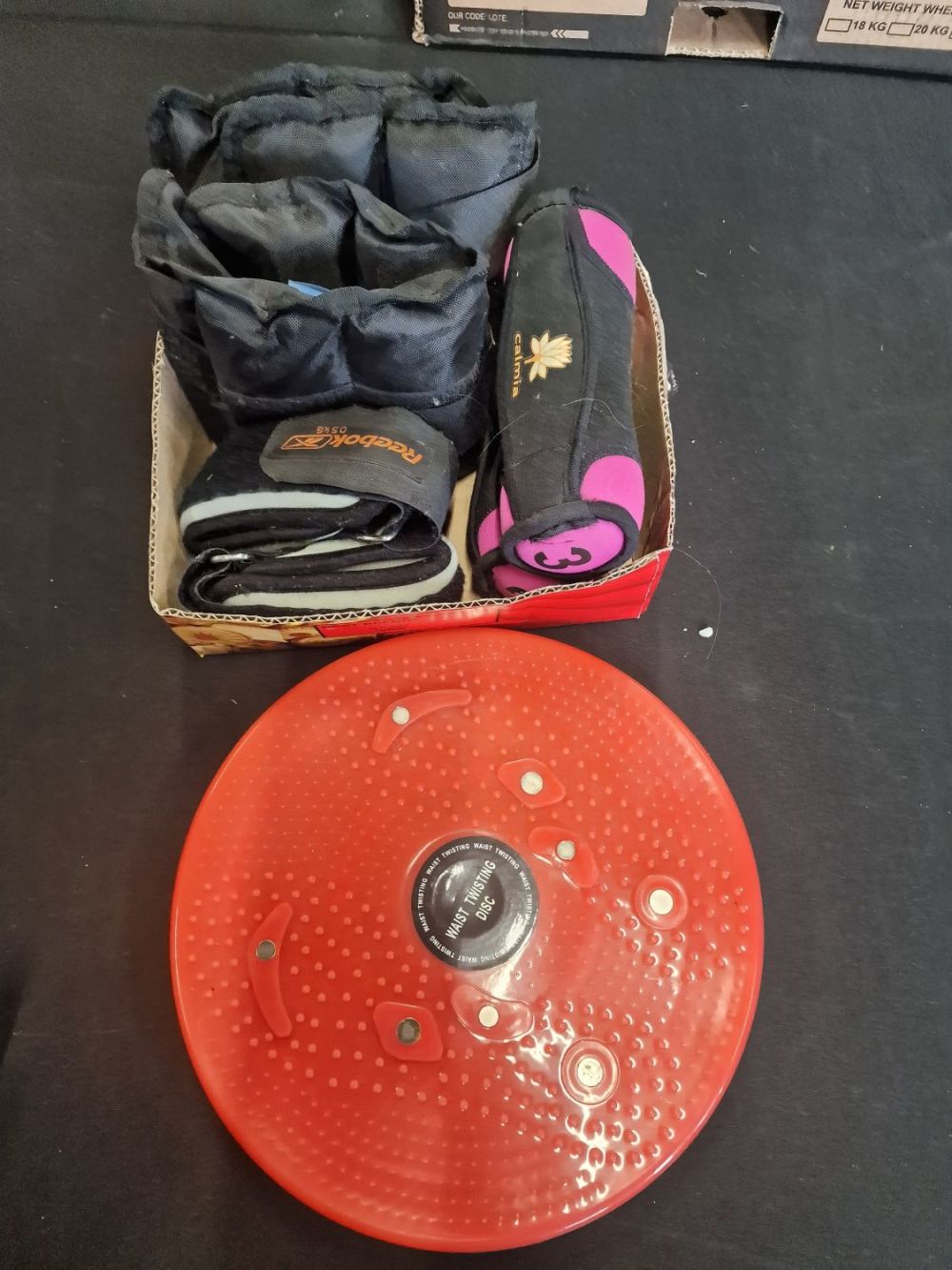 Lot 165: Ankle and wrist weights and waist trimming disc