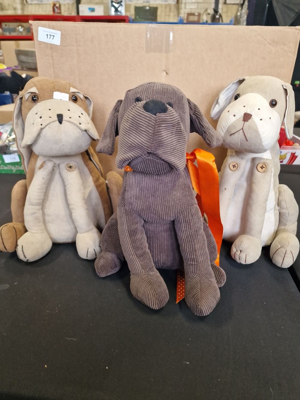 Lot 178: Three dog door stops