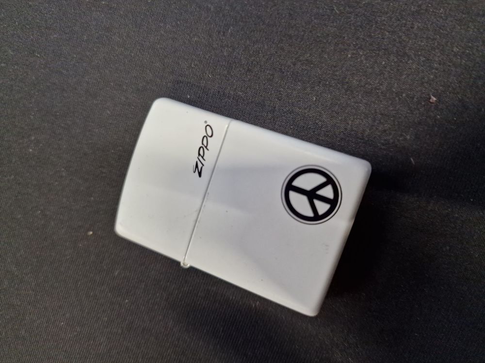 Lot 216: ZIPPO - peace sign.
