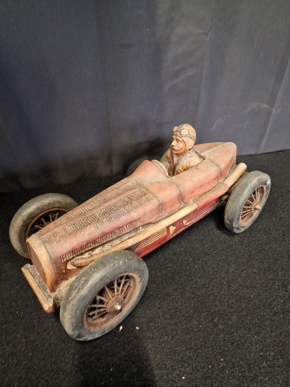 Lot 222: A vintage model racing car made from plaster