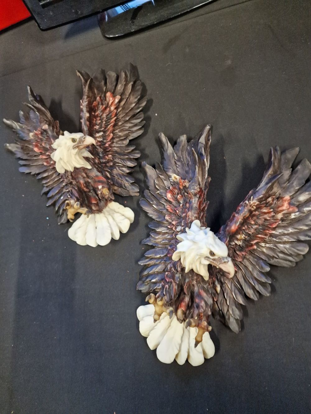 Lot 234: A pair of wall mounted eagles approximately 36cm