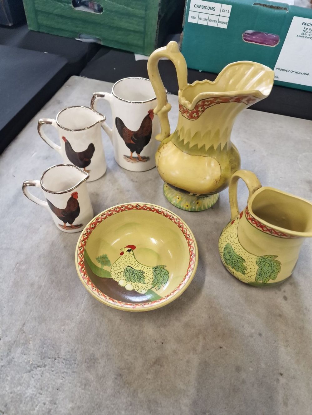 Lot 244: Collectable farm house ware. Three rooster jugs 3...