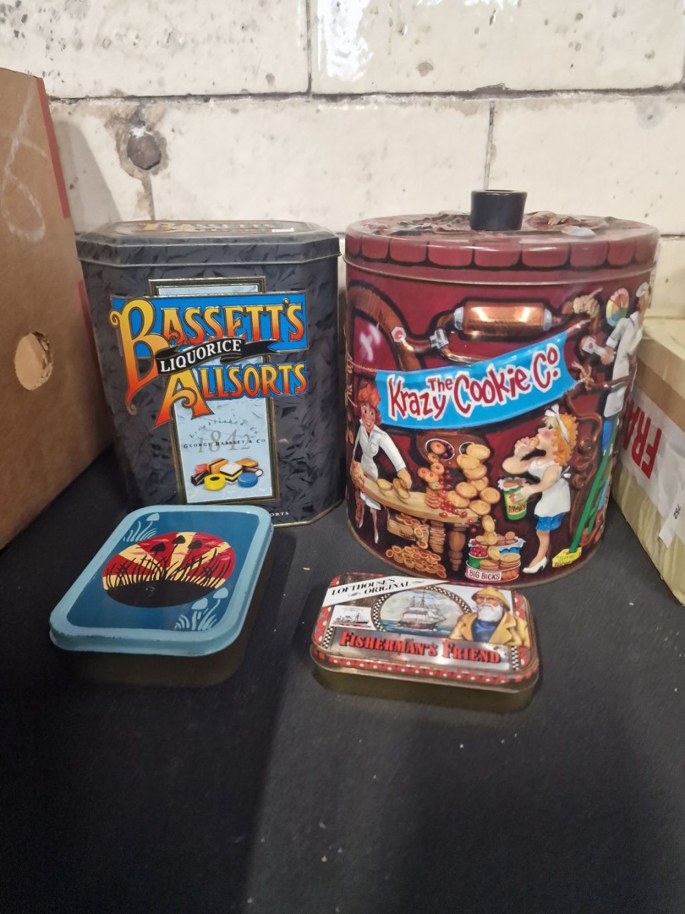 Lot 284: Four vintage tins including The Krazy cookie Co.