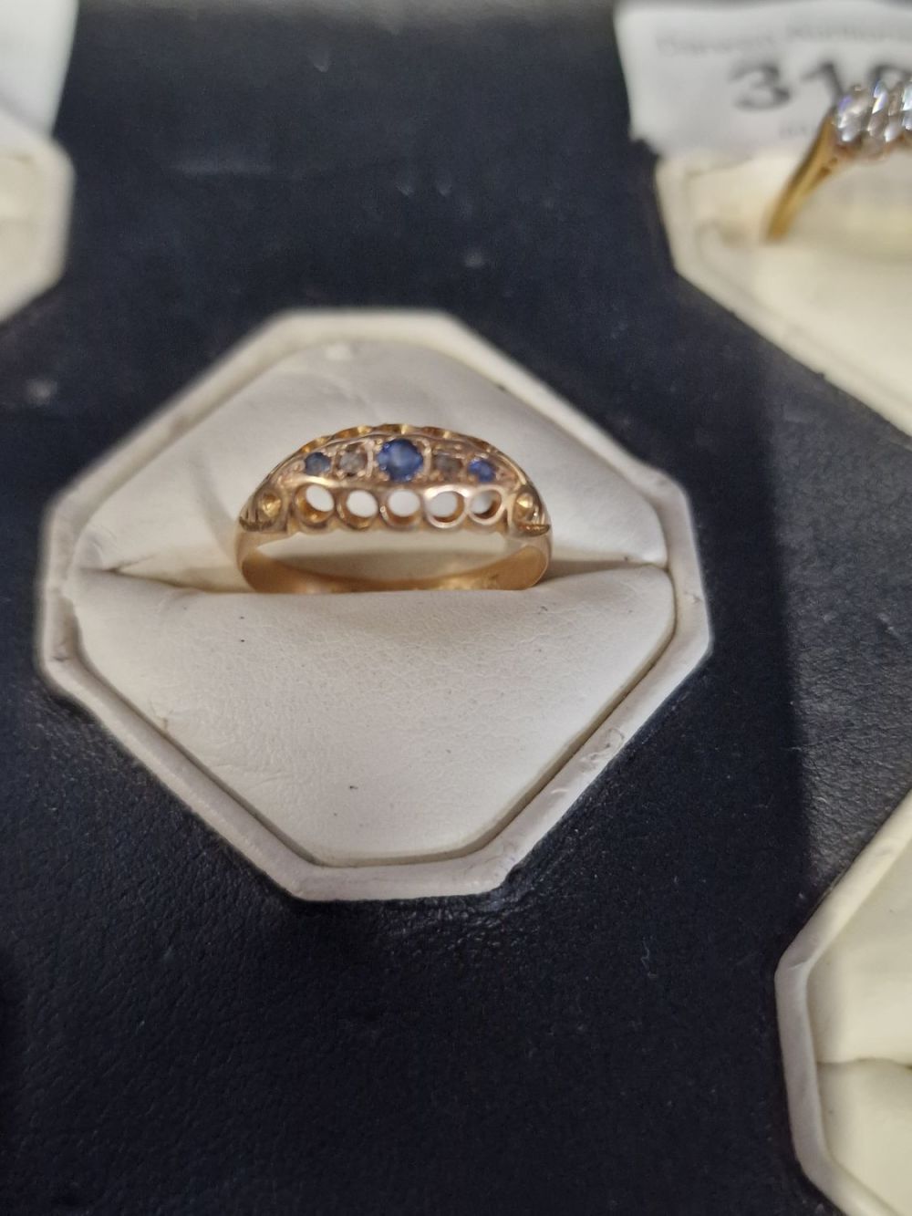 Lot 314: 18ct gold Diamond and Sapphire ring. Size N...