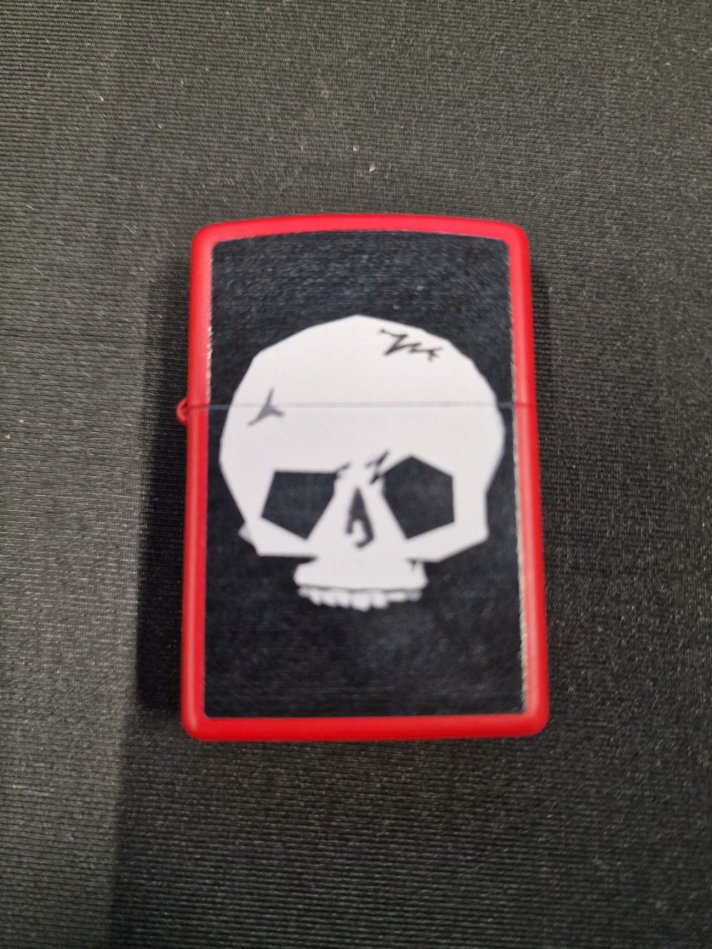 Lot 360: Zippo light red and black Skull design