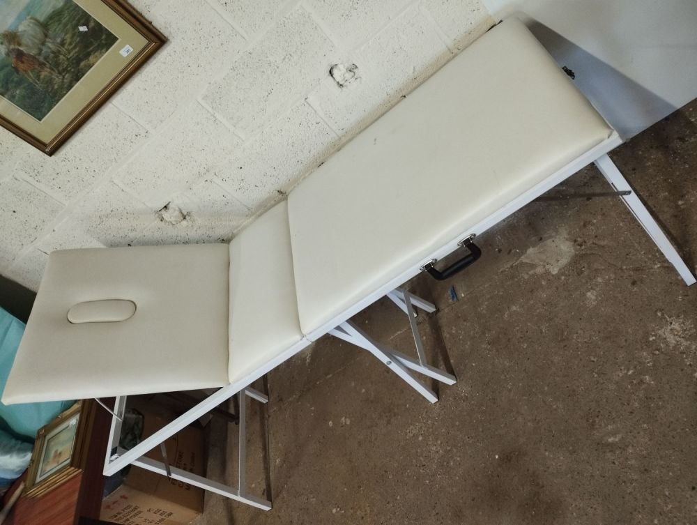 Lot 151: Folding Portable Cushioned Massage Table with Carry Bag....