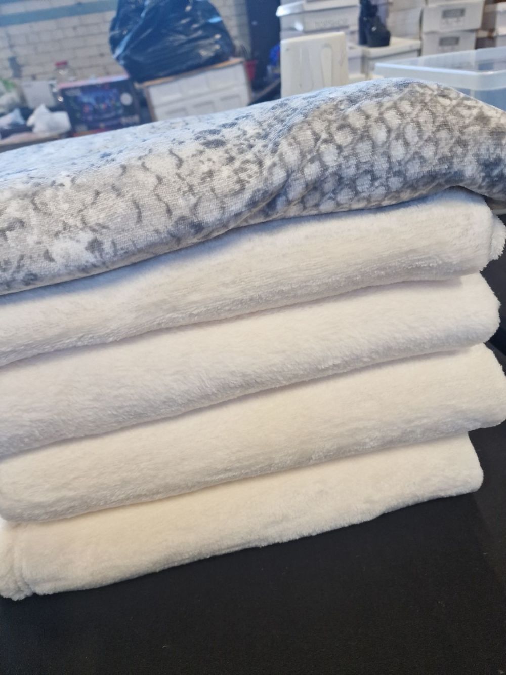 Lot 171: Four brand new cream teddy fleece throws or...