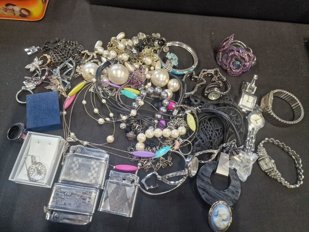 Lot 191: A bundle of costume jewellery and vintage lighters