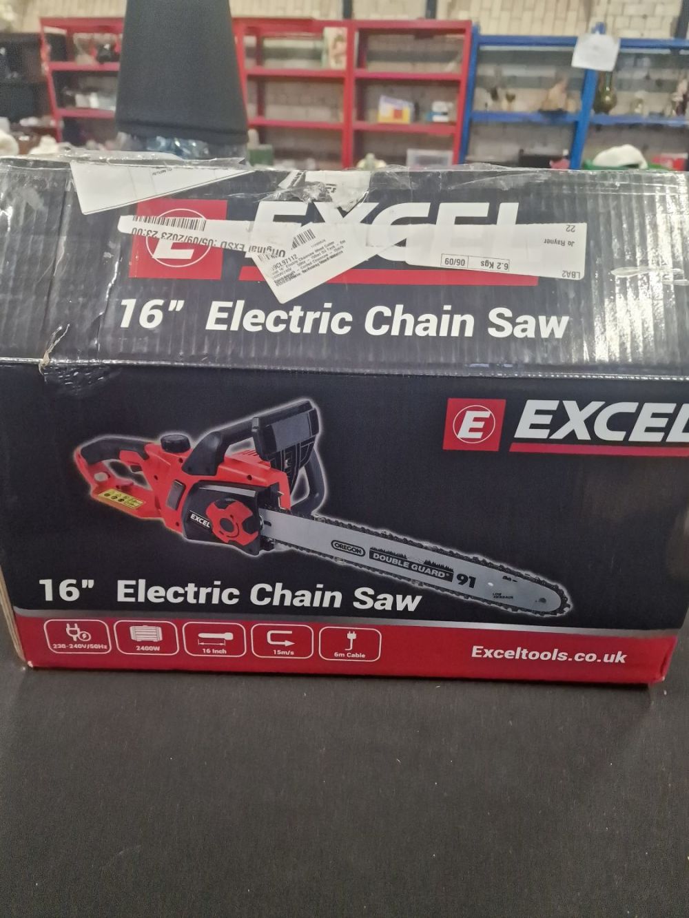 Lot 196: 16" electric chain saw. Untested. Needs putting together