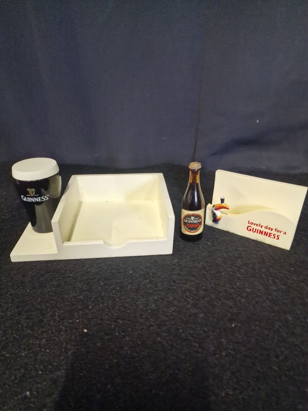 Lot 203: Vintage Guinness memorabilia, memo pad, business card holder...
